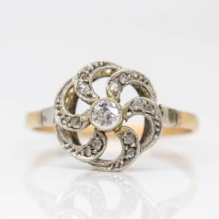 Antique Art Deco 18k gold and Platinum Diamond Ring: Fabulous Art Deco ring centered with one old mine cut diamond of H-SI1 quality that weighs 0.10ctw. Handmade in 18k gold and platinum on the top, this lovely work of art is also adorned with 12 rose