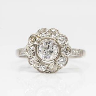 Handmade Platinum Old Mine Diamond Halo Engagement Ring: Fabulous platinum engagement ring with central old mine cut diamond of H-SI1 quality that weighs 0.40ctw. The central delightful stone is surrounded by 16 old mine cut diamonds of H-SI1 quality that