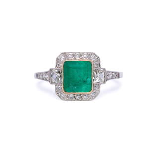 Platinum Colombian Emerald and Diamond Engagement Ring: Hand fabricated in platinum, this exquisite engagement ring is centered with one natural Colombian emerald that weighs 1.22ctw. The emerald is embellished right and left with French cut diamonds of