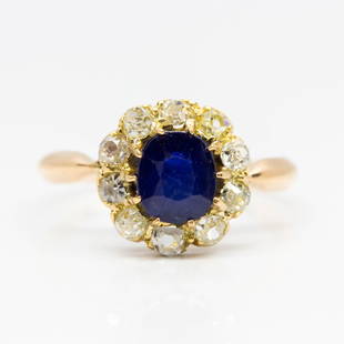 Antique Victorian 18k Gold Natural Sapphire and Diamond: Authentic Victorian engagement ring with central natural cushion cut sapphire that weighs 1.20ctw approx. This lovely ring, handmade in 18k gold during the late 1890´s, is also embellished with 10