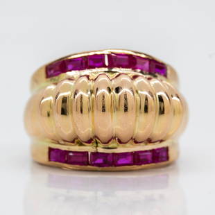 Original Vintage 1940’s Retro Ruby Ring: This classic 1940s Retro style ring was crafted in 18k gold. Its handmade design is adorned with 12 baguette cut synthetic rubies that weigh 1.50ctw. Its exquisite design displays a ribbed shank. 