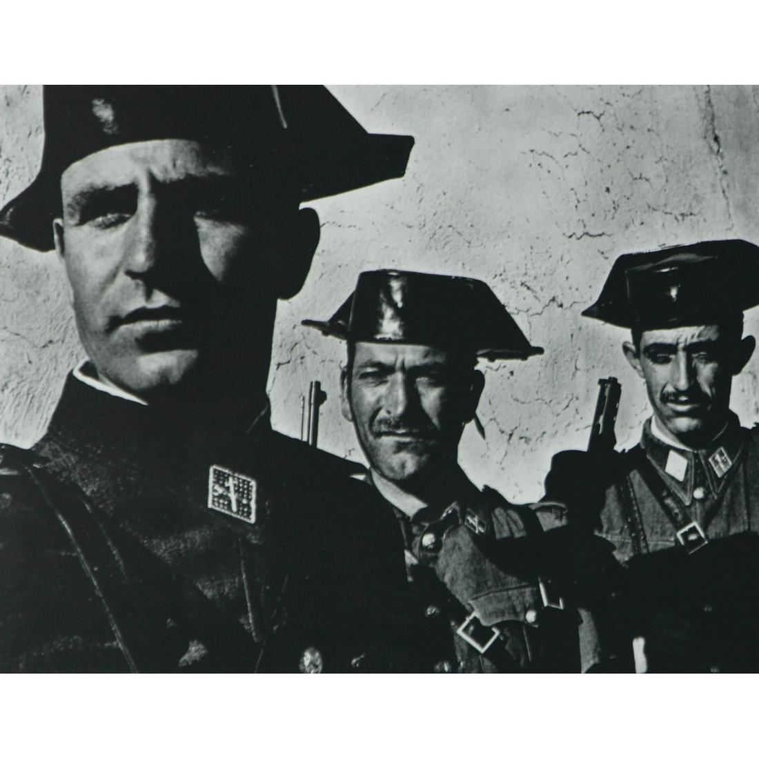 W. EUGENE SMITH - Three Spanish Soldiers: Artist: W. EUGENE SMITH Print Title: Three Spanish Soldiers Medium: Sheet-Fed Gravure Printed in 1960s Printed in USA Image Size approx.: 6 x 7.5 inches William Eugene Smith (1918-1978) was an America