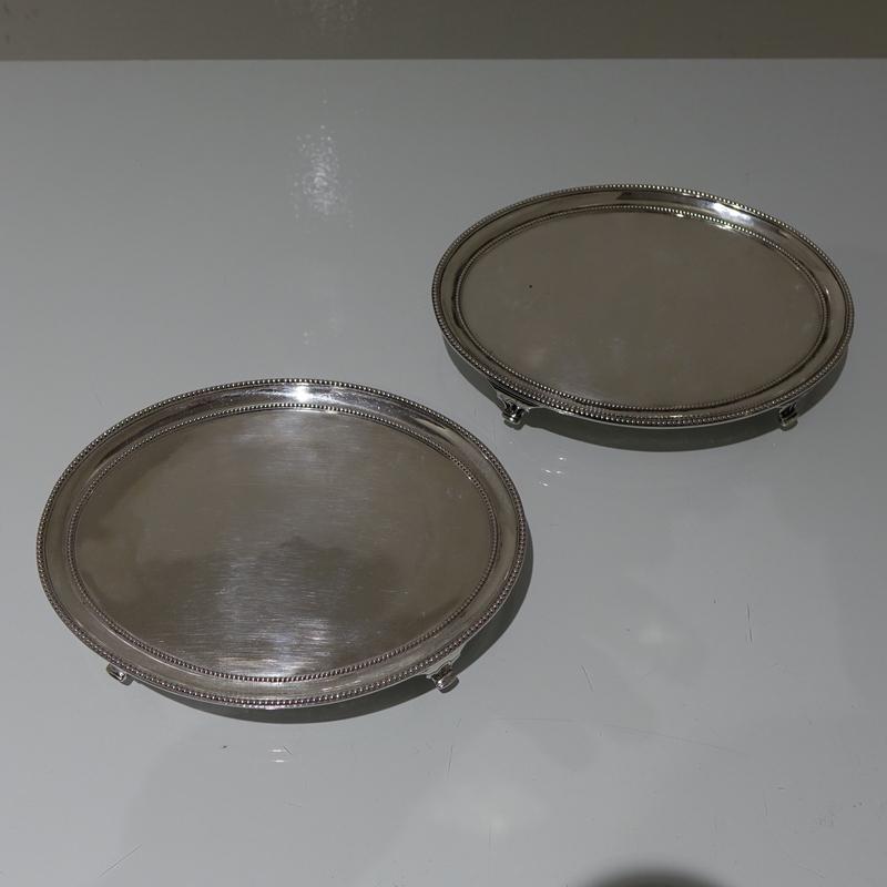 18th Century Antique George III Sterling Silver Pair: Title: 18th Century Antique George III Sterling Silver Pair Salvers London 1781 Daniel Smith & Robert Sharp Description: A beautiful and rare pair of oval salvers decorated with inner and outer applie