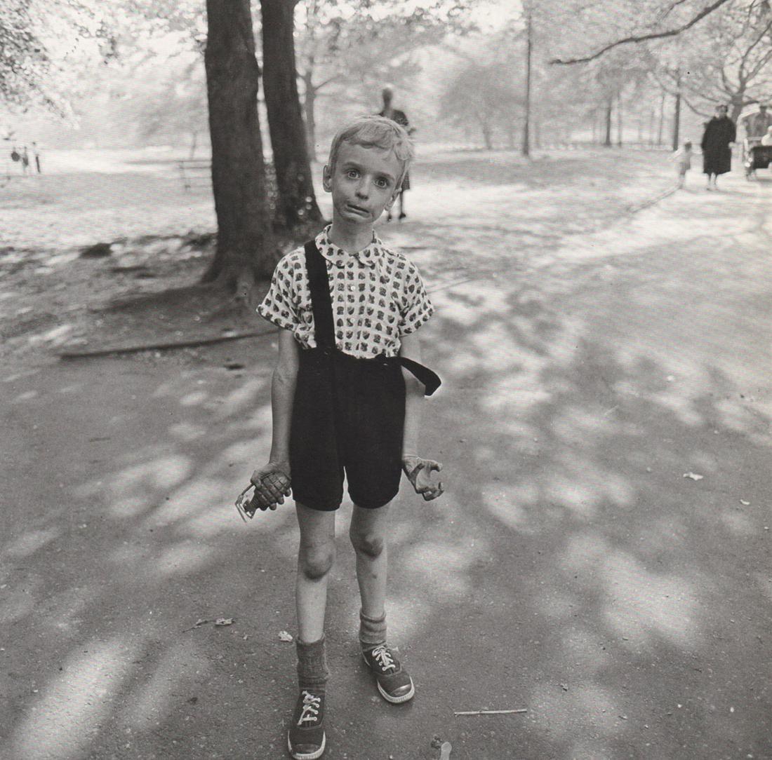 DIANE ARBUS - Child with toy grenade in Central Park,: Artist: DIANE ARBUS Print Title: Child with toy grenade in Central Park, NYC, 1962 Medium: Photoengraving Printed 1970’s in the US Image size (inches) approx. 8 x 8” Diane Arbus (1923 –1971),was
