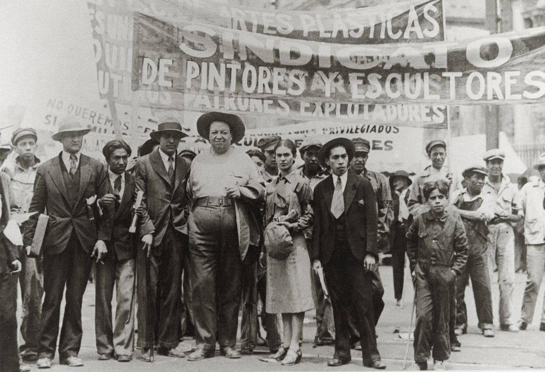 TINA MODOTTI - Diego Rivera, Frida Kahlo At March: Artist: Tina Modotti Title: Diego Rivera And Frida Kahlo At The May Day March, 1929 Medium: Photo Litho, 1999, China Dimensions: 7.1x4.85" Description: Heat Wax Mounted on 8.5x11" Conservation Board A