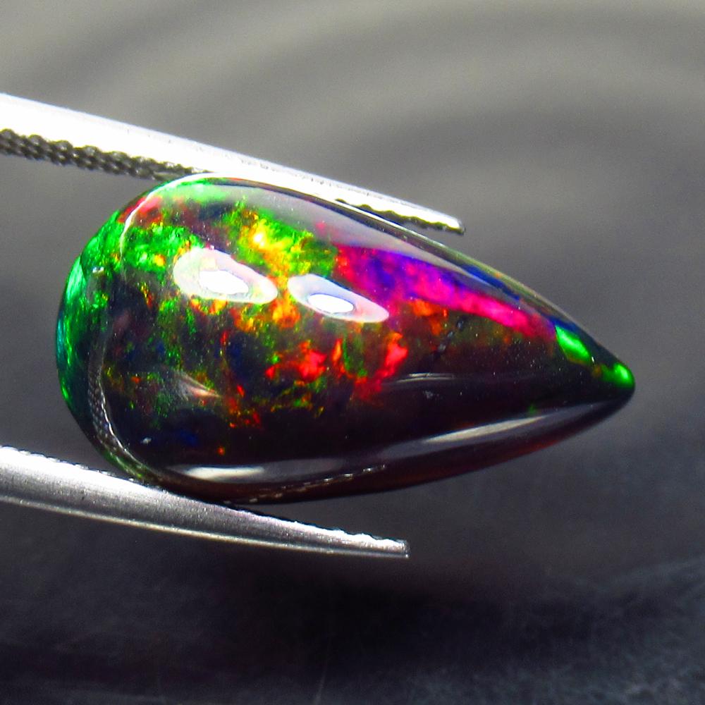 6.08 Ct Natural Ethiopian Black Fire Opal Pear Cab: No Reserve! Title: 6.08 Ct Natural Ethiopian Black Fire Opal Pear Cab Stone Clarity: Translucent Gemstone: Natural Black Opal Carat Weight: 6.08 Size/Dimensions: 18.60 x 10.10 x 7.30 mm Additional Inf
