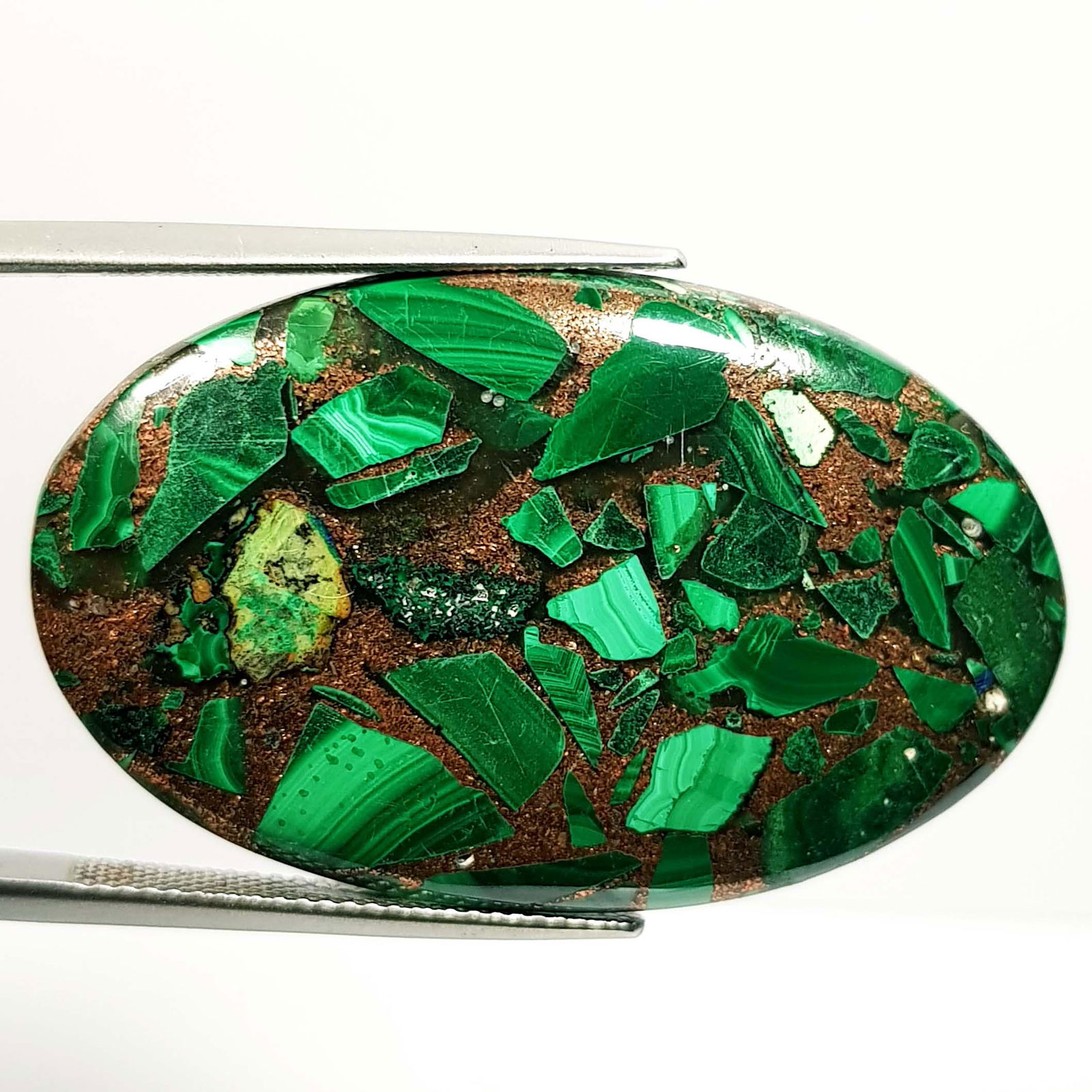 45.45 ct Natural Copper Malachite: No Reserve! Title: 45.45 ct Natural Copper Malachite Color/Clarity: Opaque Gemstones: Loosegemstone Carat Weights: 45.45 Size/Dimensions: 39.60 x 24.75 x 4.75 Additional Information: Oval - Africa Shi
