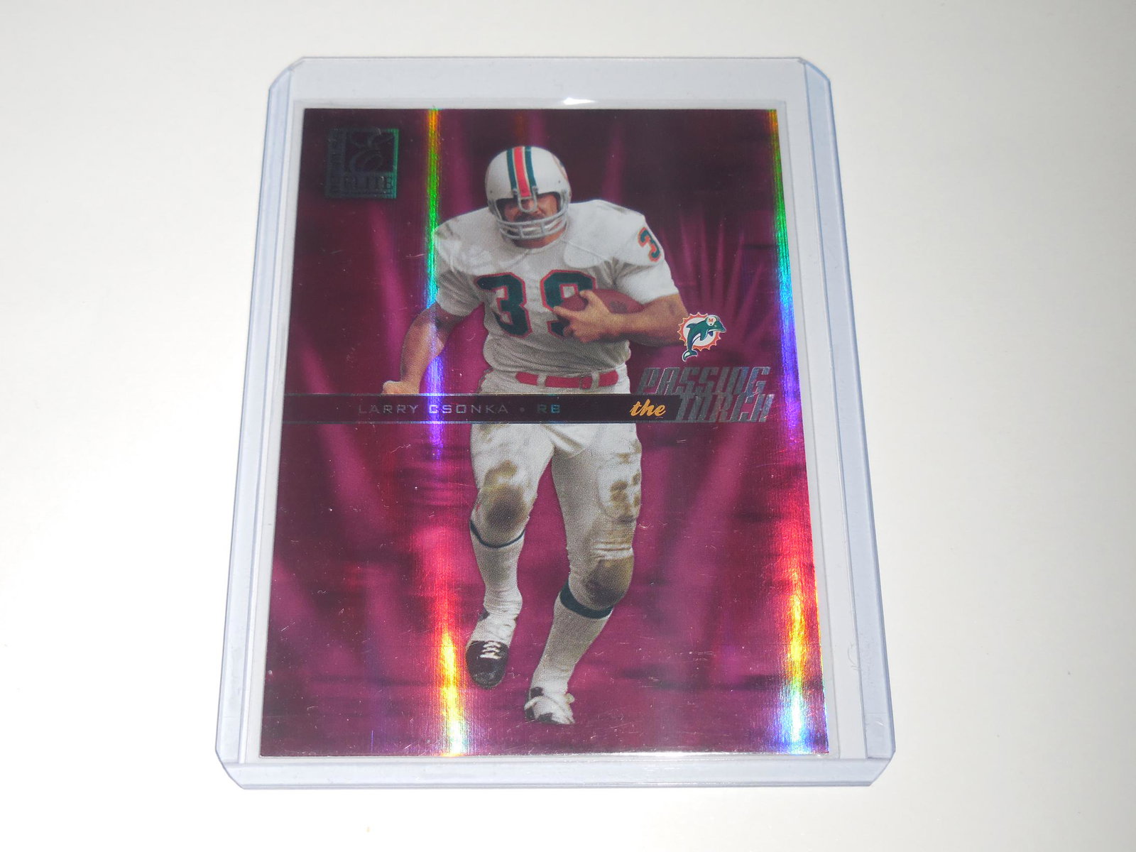 2004 ELITE LARRY CSONKA PASSING THE TORCH HOLO: No Reserve! Title: 2004 ELITE LARRY CSONKA PASSING THE TORCH HOLO Description: THIS IS A VERY NICE CARD FOR ANY COLLECTOR. APPROXIMATELY NEAR MINT CONDITION OR BETTER. COMES WITH SLEEVE AND TOP LOADER