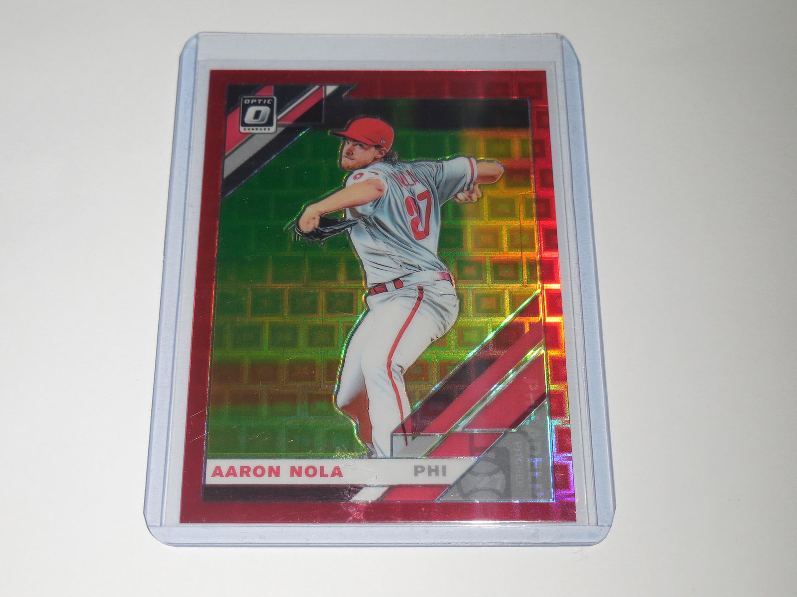 2019 DONRUSS OPTIC AARON NOLA RED PRIZM #'D 44/99: No Reserve! Title: 2019 DONRUSS OPTIC AARON NOLA RED PRIZM #'D 44/99 Description: THIS IS A VERY NICE CARD FOR ANY COLLECTOR. APPROXIMATELY NEAR MINT CONDITION OR BETTER. COMES WITH SLEEVE AND TOP LOA