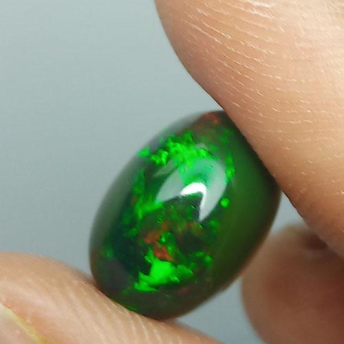 3.90 CTS NATURAL ETHIOPIAN BLACK OPAL OVAL GOOD LUSTER: Title: 3.90 CTS NATURAL ETHIOPIAN BLACK OPAL OVAL GOOD LUSTER LOOSE GEMSTONES Carat Weights: 3.9 Size/Dimensions: 12.3 x 8.5 x 6.3 MM Additional Information: HEATED WITH PLAY OF COLOR Reserve: $30.00 