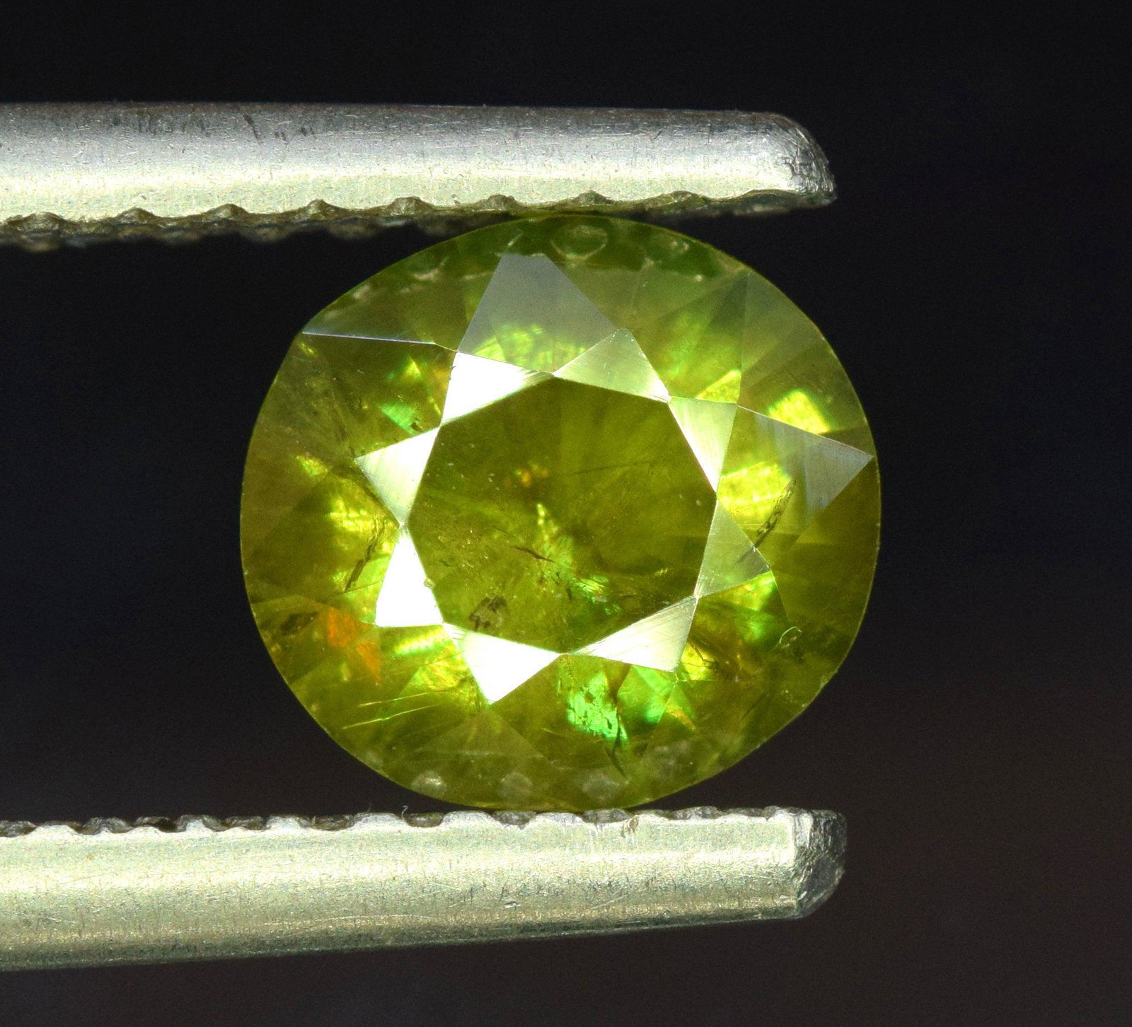Sphene Full Fire Natural Loose Gemstone - 1.35 Carats -: Sphene Full Fire Natural Loose Gemstone - 1.35 Carats - 8*7*4 mm Weight : 1.35 Carats Size : 8*7*4 mm Origin : Pakistan Treatment : Natural Cut : Round Economy Shipping A1-55 Reserve: $40.00 Shipping: