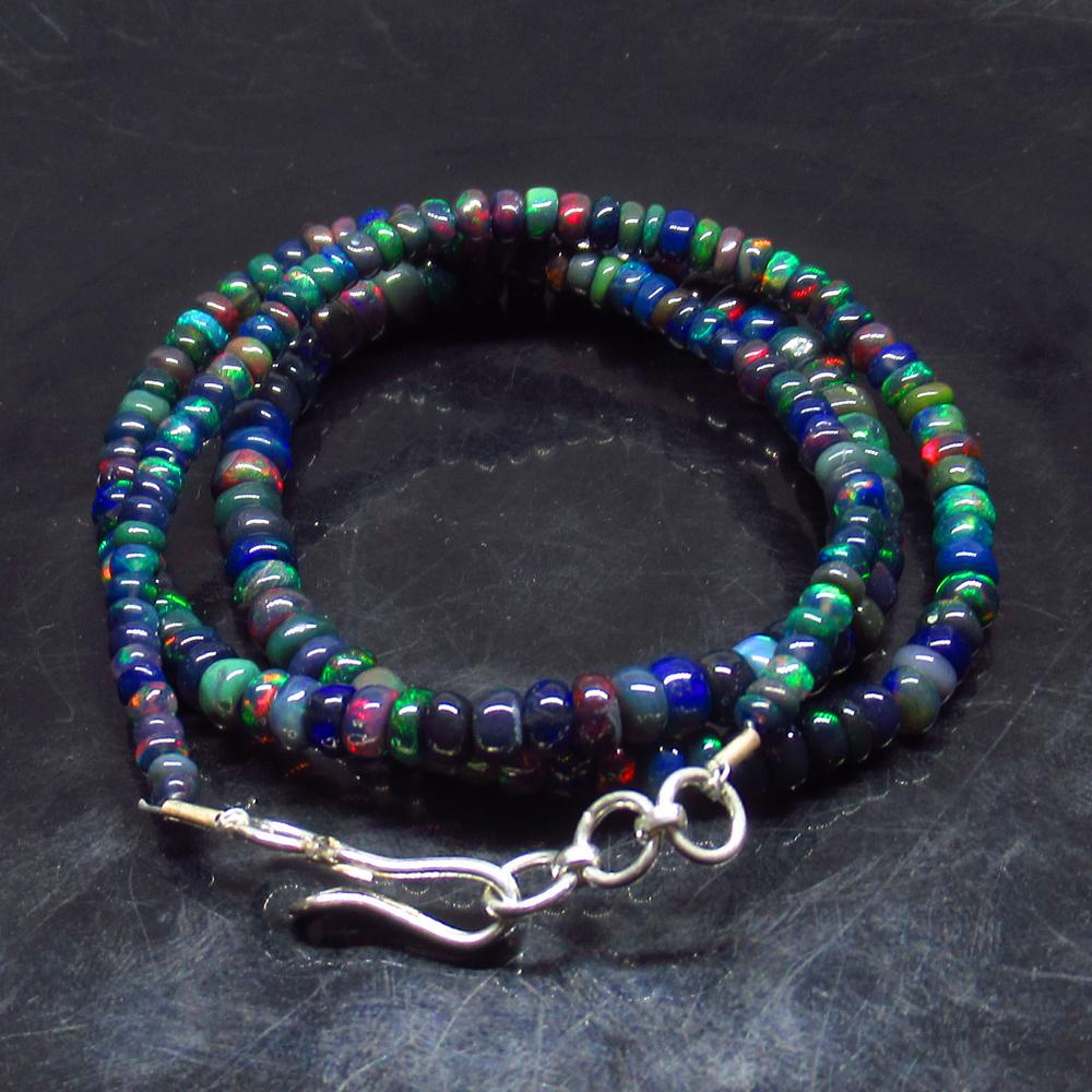 40.15 Ctw 925 Silver 185 Black Fire Opal Beads Necklace: Title: 40.15 Ctw 925 Silver 185 Black Fire Opal Beads Necklace Ready Wear Stone Clarity: Transcluent Gemstones: Black Opal Beads Carat Weights: 40.15 Size/Dimensions: 2.60 to 5.90 mm / 185 PC's / 18" 