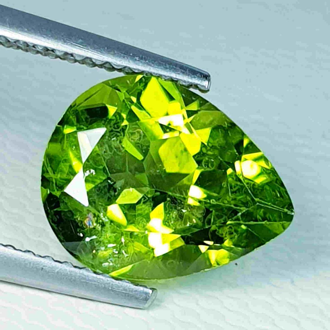 3.59 ct "IGI Certified" Natural Peridot: Title: 3.59 ct "IGI Certified" Natural Peridot Brand: Peridot Gemstones: Loosegemstone Color/Clarity: VVS Carat Weights: 3.59 Size/Dimensions: 11.11 x 8.88 x 5.74 Additional Information: International