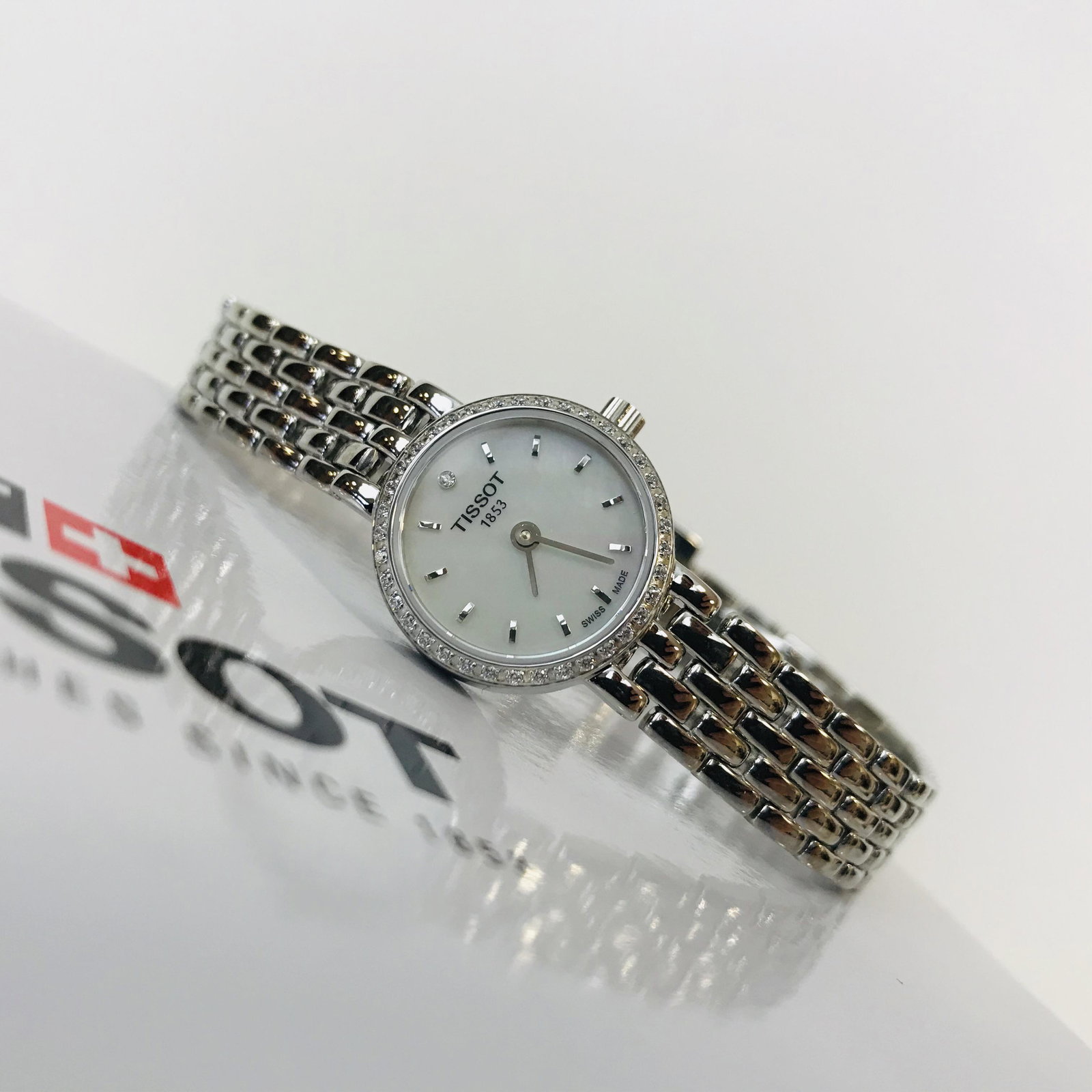 TISSOT Mother of Pearl Diamond Studded Women's Watch: Title: TISSOT Mother of Pearl Diamond Studded Women's Watch Brand: TISSOT Size: 19.5 mm Bracelet Length: Standard 165mm-180mm Movement Type: Quartz ETA 901.001 (Swiss Made) Box/Papers:In Orignal Box,