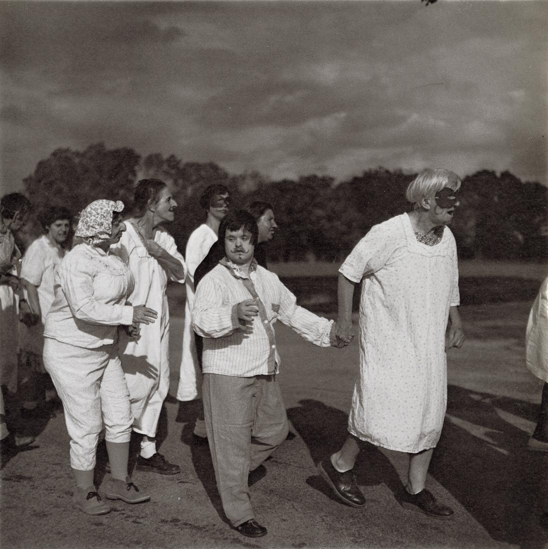 DIANE ARBUS - Untitled (7), 1970-71: Artist: Diane Arbus Title: Untitled (7), 1970-71 Medium: Photo Litho, 1972, USA Dimensions: 8.25x8.3" Description: Heat Wax Mounted on 11x14" Conservation Board Artist Bio: Diane Arbus was an American