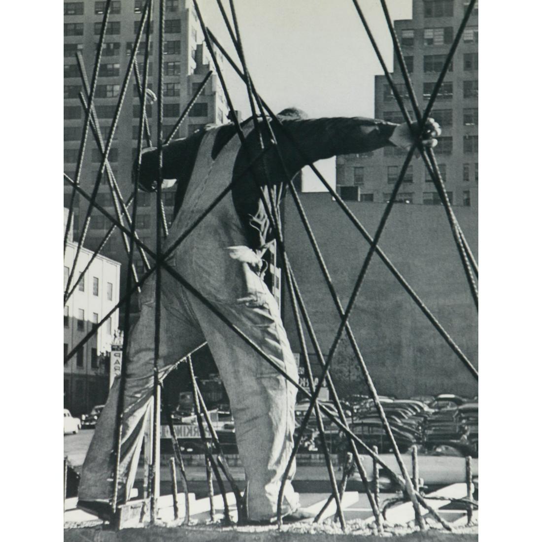 WERNER BISCHOF - Construction worker between steel: Artist: WERNER BISCHOF Print Title: Construction worker between steel cables, NYC Medium: Sheet-fed Gravure Printing Date: 1950s Printed in Switzerland Image Size: 11 x 8 inches Werner Bischof (1916-1