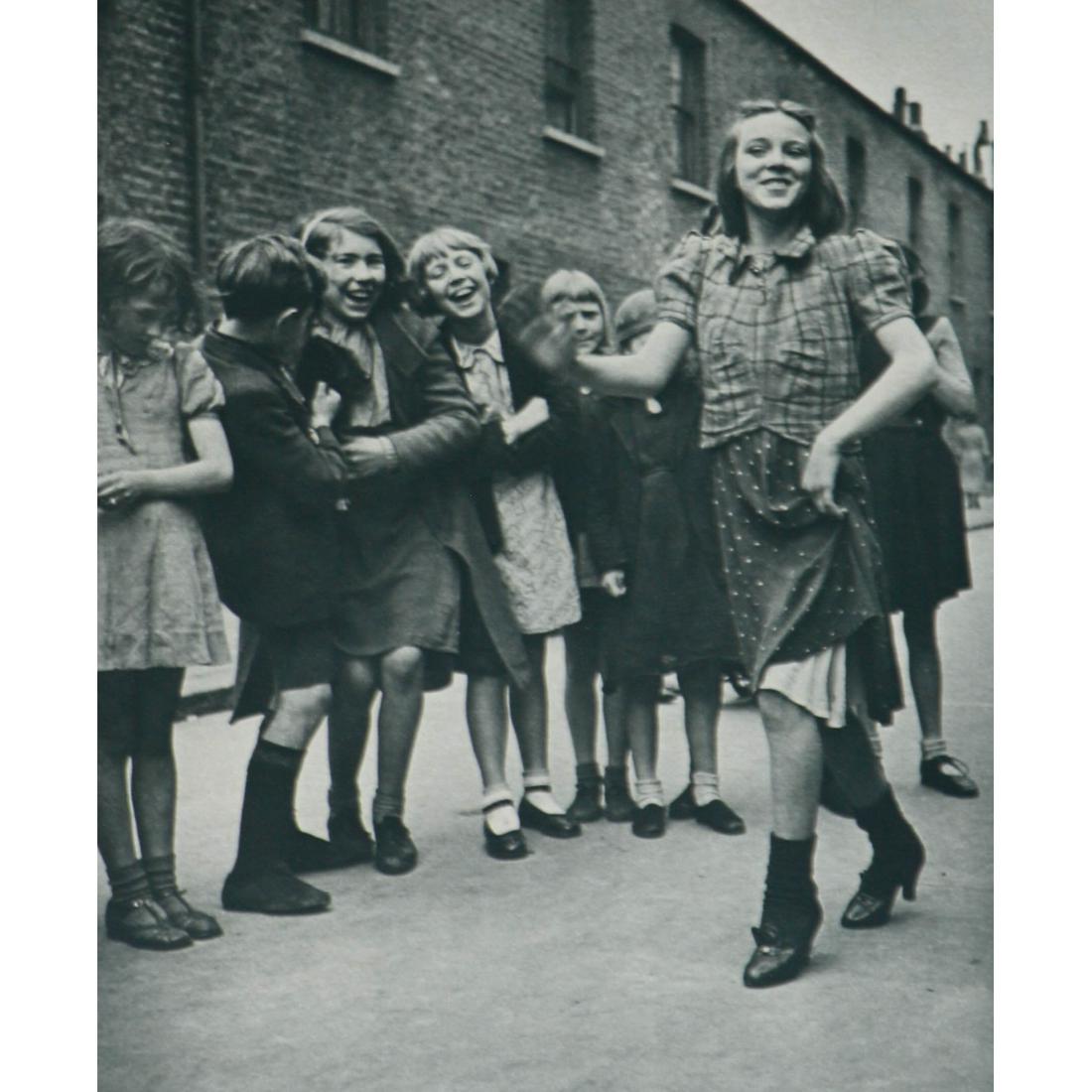 BILL BRANDT - The Lambeth Walk: Artist: BILL BRANDT Print Title: The Lambeth Walk Medium: Sheet-fed Gravure Printing Date: 1950's Printed in USA Image size approx. 6.25 x 5.25 inches Bill Brandt (1904-1983) was a British photographe