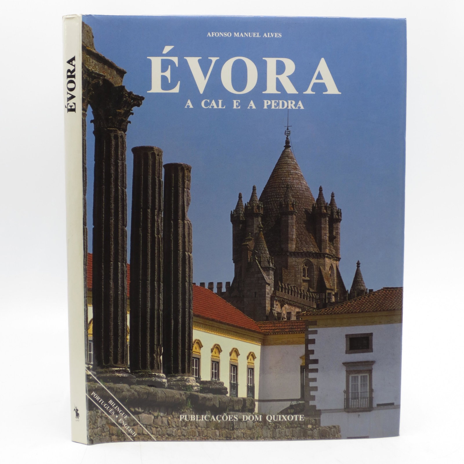 Evora A Cal E A Pedra (White and Stone): SKU #: 21307 Blue cloth backed boards (hardcover) in pictorial dust jacket in near fine condition: showing very light shelf wear. Text in Portuguese and English. Profusely illustrated. Title: Evora A 
