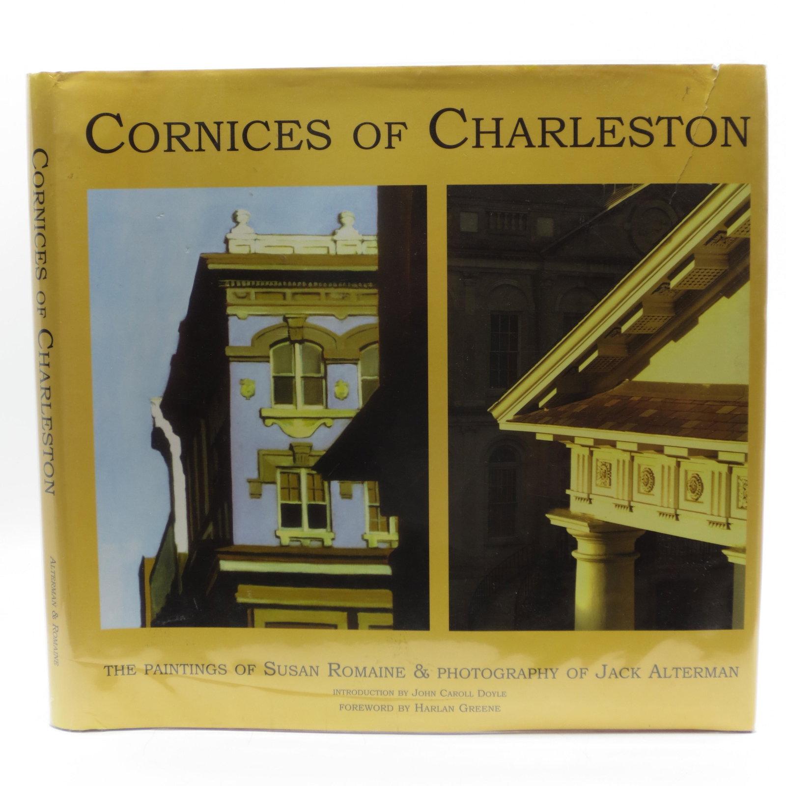 Cornices of Charleston: The Paintings of Susan Romaine: SKU #: 23547 Orange cloth with silver lettering, damp stain on front cover, decorated end-papers, gift inscription on front decorated end-paper, author's signatures on title page, color illustrations,