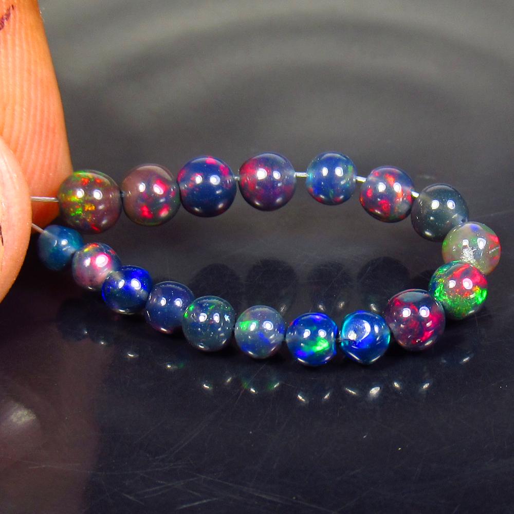 3.11 Ctw Natural 18 Drilled Black Fire Opal Ball Beads: No Reserve! Title: 3.11 Ctw Natural 18 Drilled Black Fire Opal Ball Beads Stone Clarity: Translucent Gemstones: Black Opal Beads Carat Weights: 3.11 Size/Dimensions: 3.00 to 4.20 mm / 18 PC's Addition