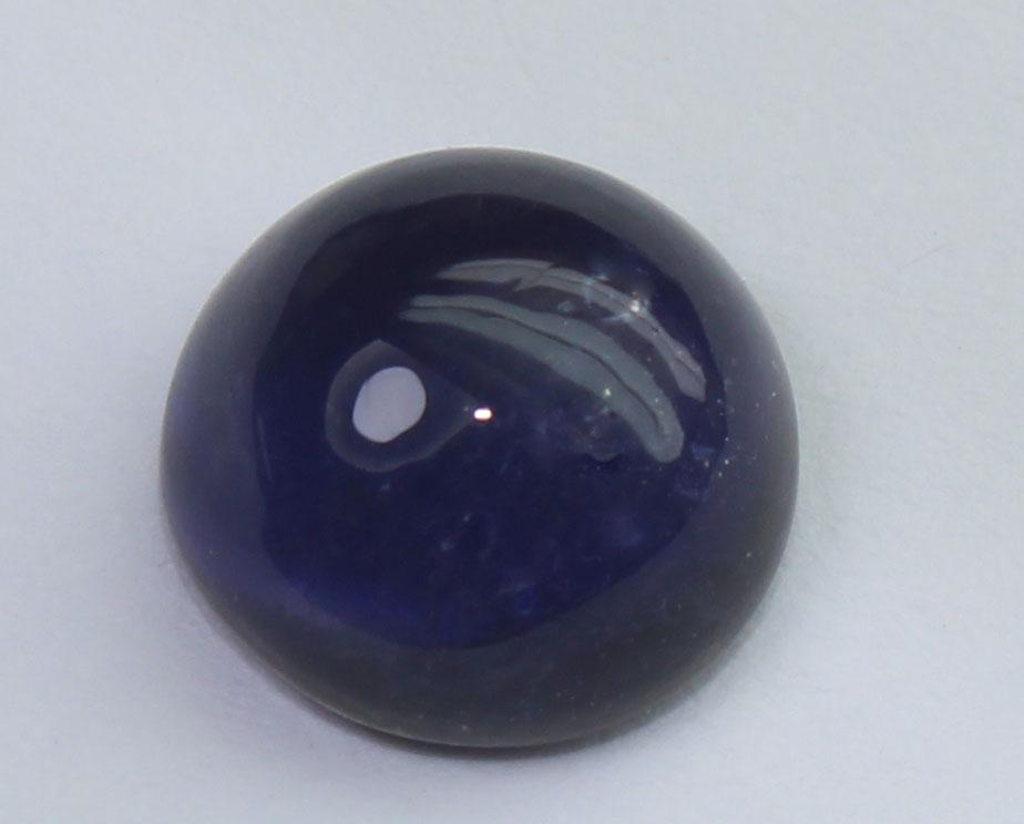 2.14 Cts Natural Iolite: No Reserve! Gemstone: Natural Iolite Weight: 2.14 Carats Measurements: 8.2-8.1x4.5 mm Shape / Cut: Round Cabochon Colour: Violet Blue Transparency: transparent Origin: India Clarity: Some Natural incl