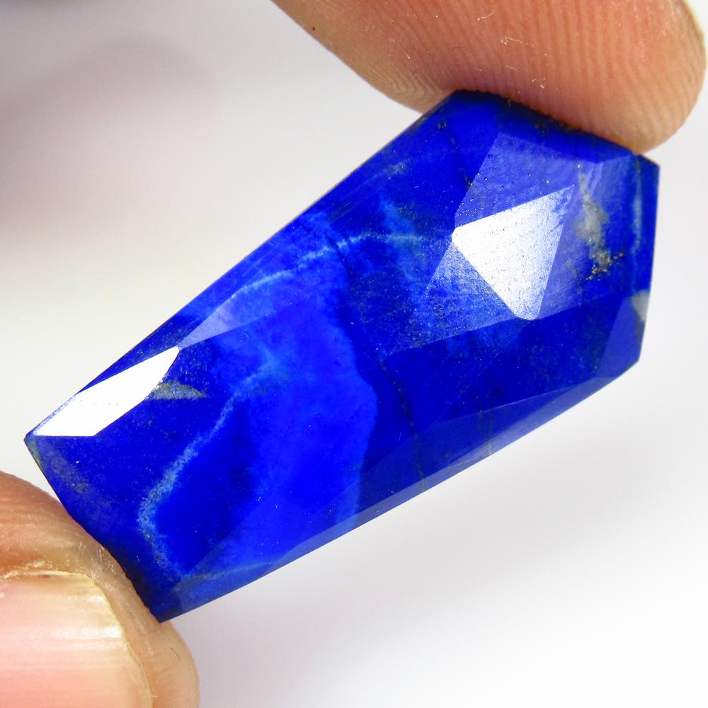 13.47 Ct Natural Lapis Lazuli Fancy Cut: No Reserve! Title: 13.47 Ct Natural Lapis Lazuli Fancy Cut Stone Clarity: Opaque Gemstone: Natural Lapis Lazuli Carat Weights: 13.47 Size/Dimensions: 31.00 x 14.90 x 4.00 mm Additional Information: Ni