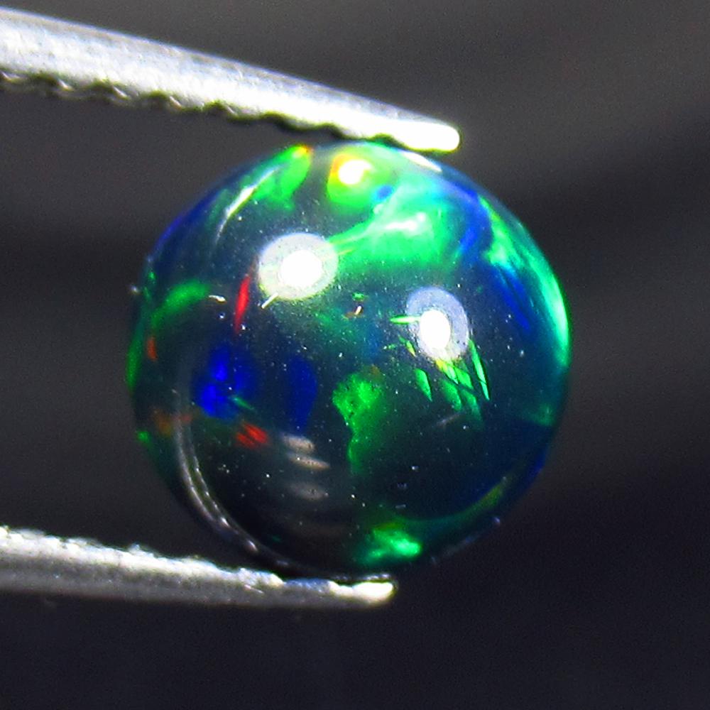 1.23 Ctw Natural Drilled Black Fire Opal Ball Beads: No Reserve! Title: 1.23 Ctw Natural Drilled Black Fire Opal Ball Beads Stone Clarity: Translucent Gemstone: Black Opal Beads Carat Weight: 1.23 Size/Dimensions: 6.80 x 6.80 mm Additional Information: 
