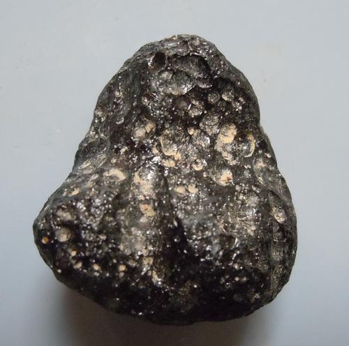 PHILIPPINITE TEKTITE - FROM METEORITE IMPACT: Title: PHILIPPINITE TEKTITE - FROM METEORITE IMPACT Origin: Paracale, Camarines Norte, Luzon, Philippines Size: 2x2x1.5 cm / 8 gram Description: irregular shaped, rounded & pitted rizalite/philippinit