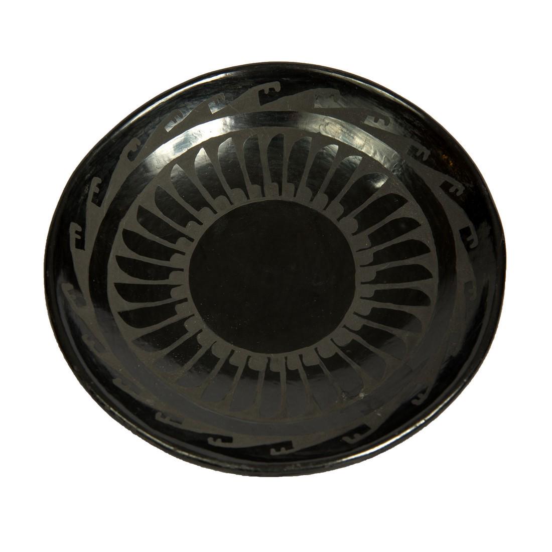 San Ildefonso black-on-black plate with feather: Title: San Ildefonso black-on-black plate with feather Description: San Ildefonso black-on-black plate with feather decoration signed Â“Santana & AdamÂ” by Santana Roybal Martinez (1909-2002) an