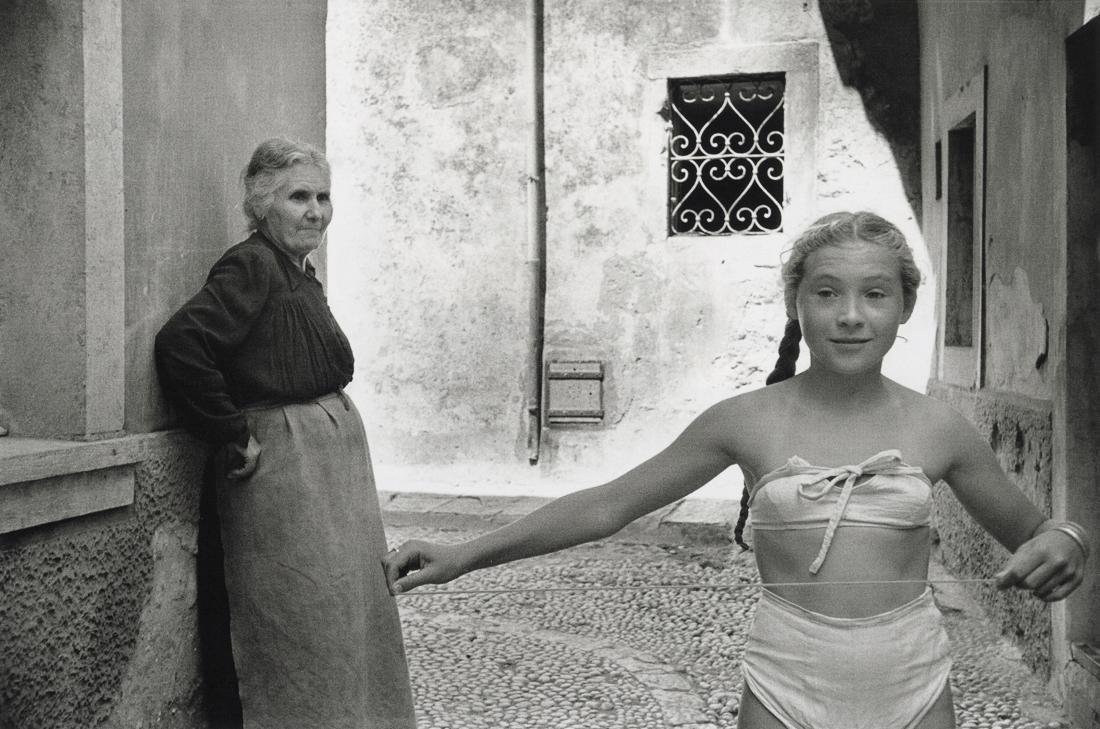 MARC RIBOUD - The Bikini Debuts In Yugoslavia, 1953: Artist: Marc Riboud Title: The Bikini Makes Its Debut In Dubrovnik, Yugoslavia, 1953 Medium: Photo Litho, 2000, Switzerland Dimensions: 10.10x6.7" Description: Heat Wax Mounted on 11x14" Conservation