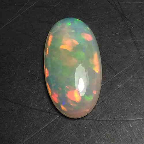 2.60 CTS NATURAL ETHIOPIAN WELO WHITE OPAL OVAL SHAPE: Title: 2.60 CTS NATURAL ETHIOPIAN WELO WHITE OPAL OVAL SHAPE GOOD LUSTER LOOSE GEMSTONES Carat Weights: 2.6 Size/Dimension: 14.5 x 7.7 x 3.9 MM Provenance/Additional Info:UNHEATED Reserve: $25.00 Ship
