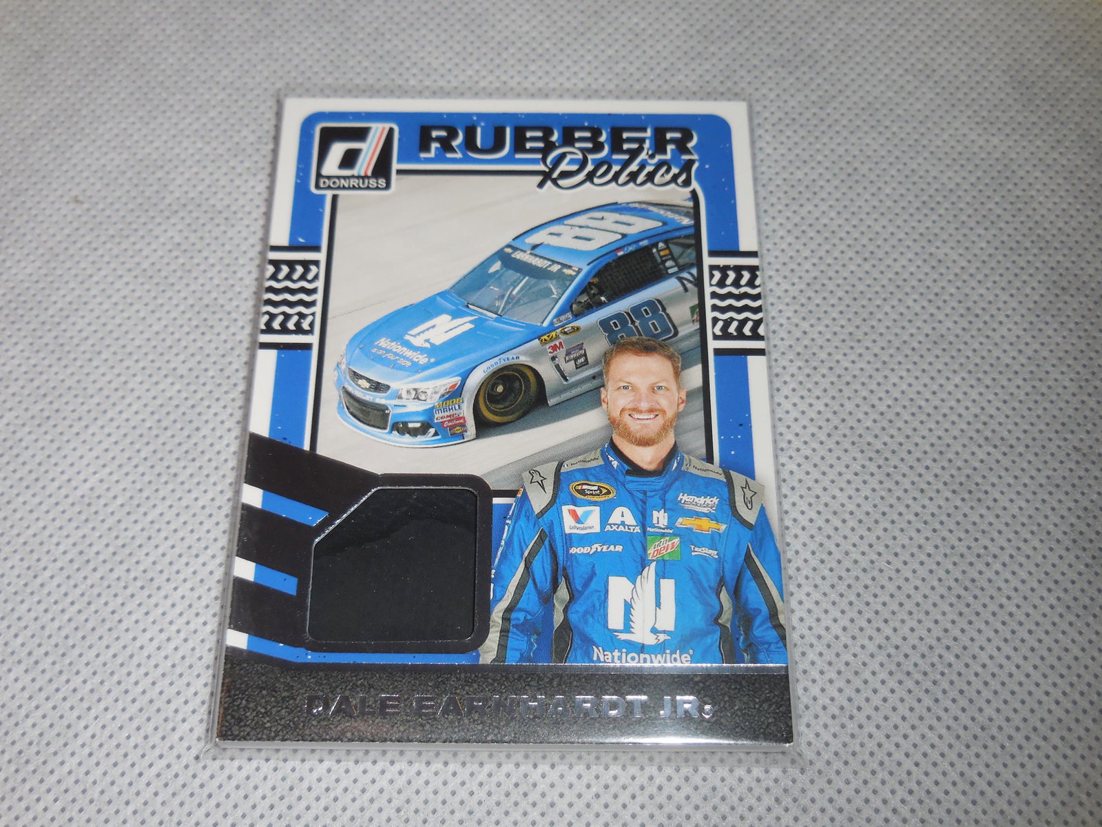 2017 DONRUSS DALE EARNHARDT JR RACE USED TIRE RELIC: A VERY NICE CARD FOR ANY COLLECTOR! PLEASE SEE PHOTOS TO DETERMINE THE EXACT CONDITION OF THIS CARD BUT IN MY OPINION IT IS APPROXIMATELY NEAR MINT CONDITION OR BETTER. THE ACTUAL CARD IN THE PHOTOS I