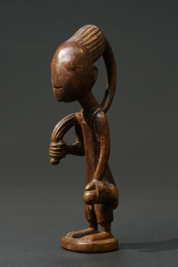 An extremely unusual Ibeji,: Title: An extremely unusual Ibeji, Maker: unknown Origin: Nigeria Date/Period: mid 20th century Materials: wood Size: 28,5 cm Description: An extremely unusual Ibeji, probably from the central or east