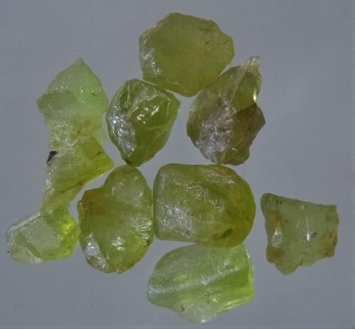 11.2 CT SET OF 10 VIVID GREEN PERIDOT - UNTREATED: Title: 11.2 CT SET OF 10 VIVID GREEN PERIDOT - UNTREATED Origin: Suppat, Kaghan Valley, Kohistan, Pakistan Size: 0.6-0.7 cm / 2.23 gram Description: set of 10 vivid green peridot Reserve: $4.00 Shippi
