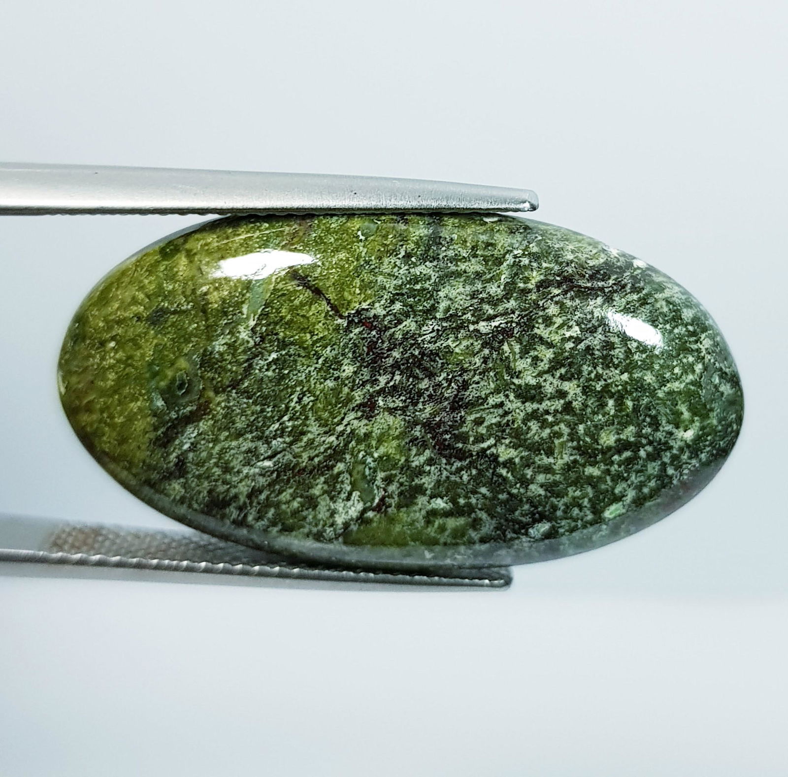 23.44 Ct Natural Dragon Jasper: No Reserve! Title: 23.44 Ct Natural Dragon Jasper Color/Clarity: Opaque Carat Weight: 23.44 Size/Dimensions: 31.50 x 17.35 x 4.90 Additional Information: Oval - Africa Shipping: Domestic: Flat-rate o