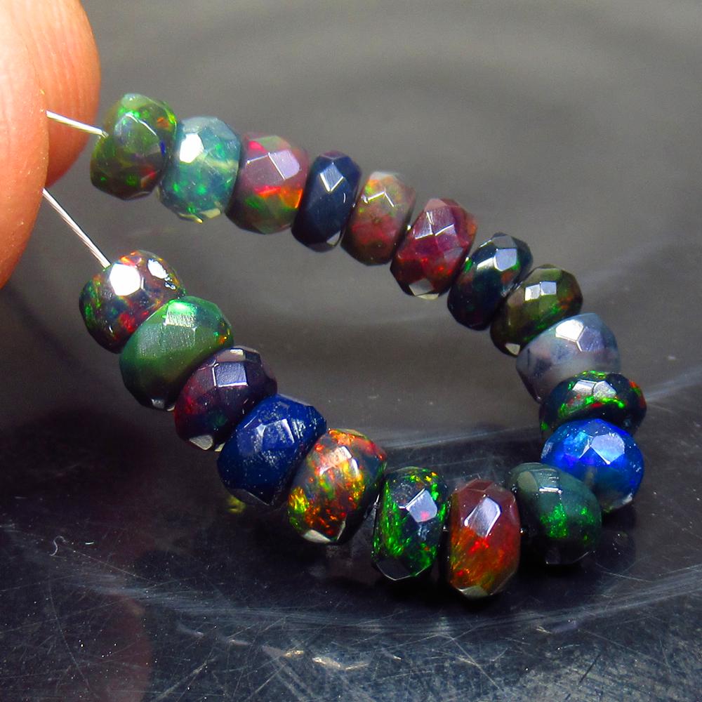 5.32 Ct Natural 19 Drilled Faceted Black Opal Beads: No Reserve! Title: 5.32 Ct Natural 19 Drilled Faceted Black Opal Beads Stone Clarity: Translucent Gemstone: Natural Faceted Black Opal Beads Carat Weight: 5.32 Size/Dimensions: 4.10 to 4.80 mm / 19 PC