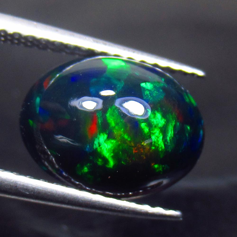2.70 Ct Natural Ethiopian Black Fire Opal Oval Cab: No Reserve! Title: 2.70 Ct Natural Ethiopian Black Fire Opal Oval Cab Stone Clarity: Translucent Gemstone: Natural Black Opal Carat Weight: 2.70 Size/Dimensions: 11.60 x 8.90 x 5.70 mm Additional Info