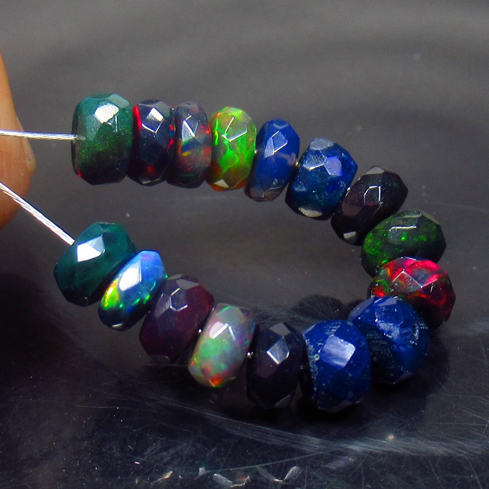5.28 Ct Natural 16 Drilled Black Faceted Fire Opal: No Reserve! Title: 5.28 Ct Natural 16 Drilled Black Faceted Fire Opal Beads Stone Clarity: Translucent Gemstone: Natural Faceted BlackOpal Beads Carat Weight: 5.28 Size/Dimensions: 4.50 to 5.00 mm / 1