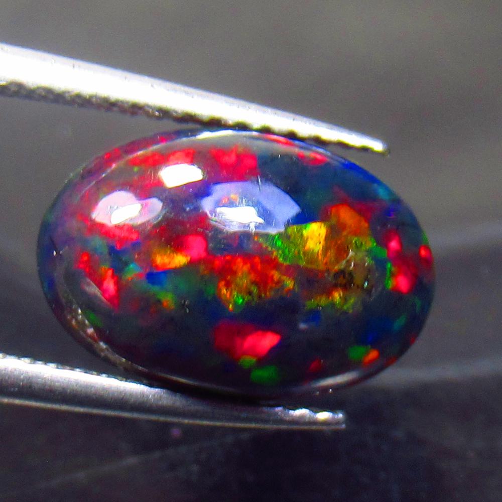 2.80 Ct Natural Ethiopian Black Fire Opal Oval Cab: No Reserve! Title: 2.80 Ct Natural Ethiopian Black Fire Opal Oval Cab Stone Clarity: Translucent Gemstone: Natural Black Opal Carat Weight: 2.80 Size/Dimensions: 13.00 x 8.70 x 5.20 mm Additional Info