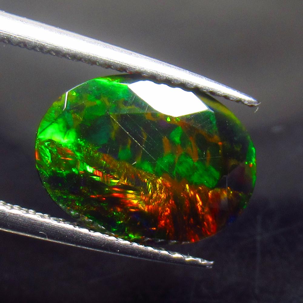 2.11 Ctw Natural Ethiopian Black Fire Opal Oval Cut: No Reserve! Title: 2.11 Ctw Natural Ethiopian Black Fire Opal Oval Cut Stone Clarity: Translucent Gemstone: Black Opal Carat Weight: 2.11 Size/Dimensions: 12.70 x 9.50 x 4.60 mm Additional Information