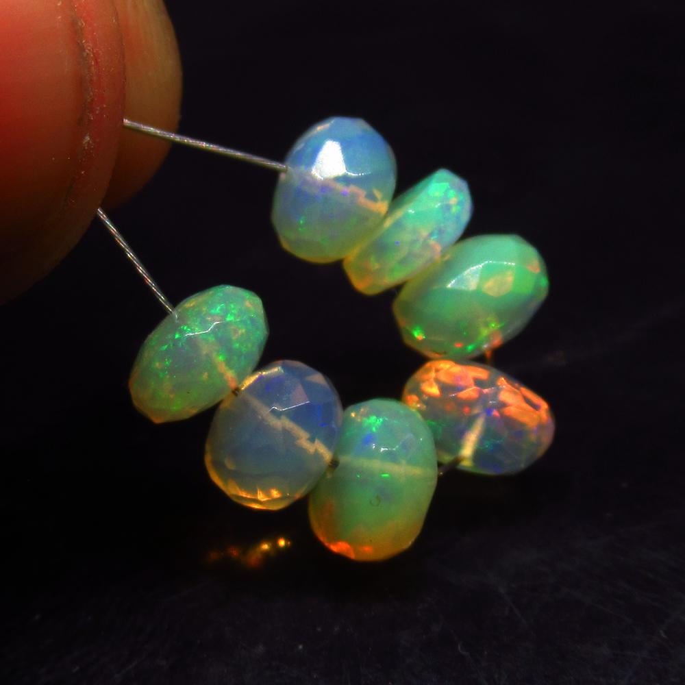 5.40 Ctw Natural 7 Drilled Faceted Fire Opal Beads: No Reserve! Title: 5.40 Ctw Natural 7 Drilled Faceted Fire Opal Beads Stone Clarity: Transparent Gemstone: Faceted Fire Opal Beads Carat Weight: 5.40 Size/Dimensions: 6.30 to 6.70 mm / 7 PC's Addition