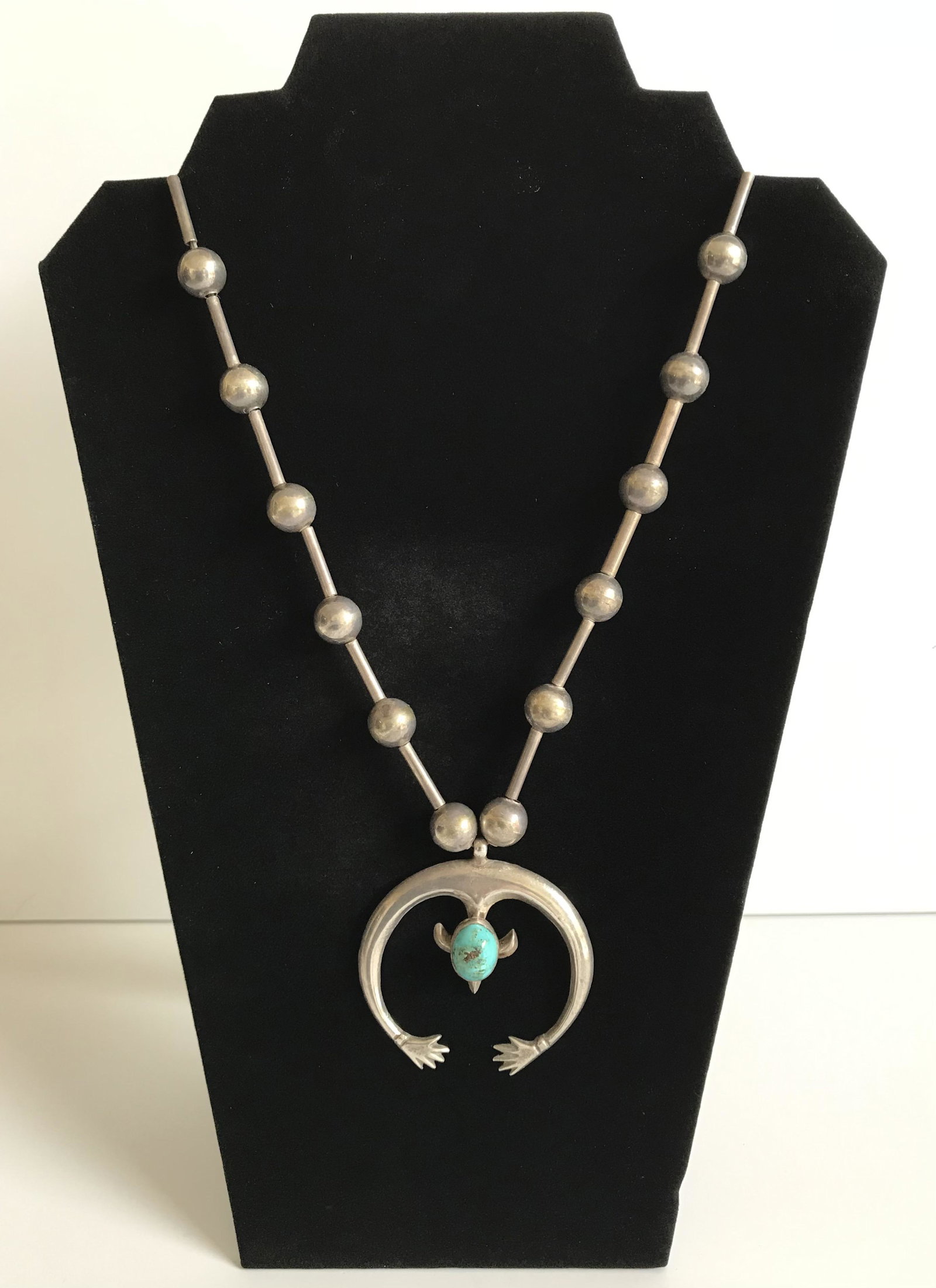 Old Pawn Sterling/Turquoise Navajo Squash Blossom: Striking, unusual rendering with sandcast pendant that has “bear paw” tips, hanging from a rod and ball chain. This is in very good overall condition and shows normal wear for a piece that pre-dat