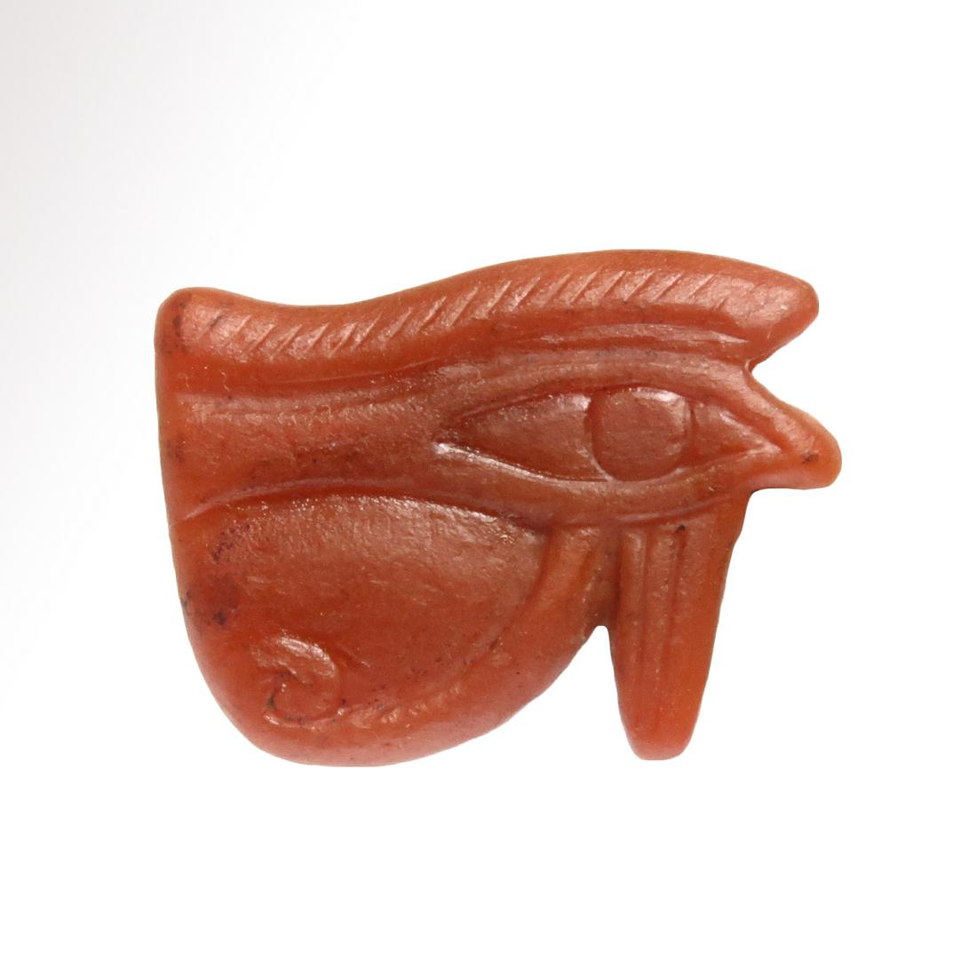 Egyptian Cornelian Eye of Horus Amulet: Title: Egyptian Cornelian Eye of Horus Amulet Date/Origin: Egypt, c. 600 B.C. Material: Cornelian Dimension: 2.9 cm L - 1 1/8 inch Provenance: Provenance: European private collection, acquired in Belg