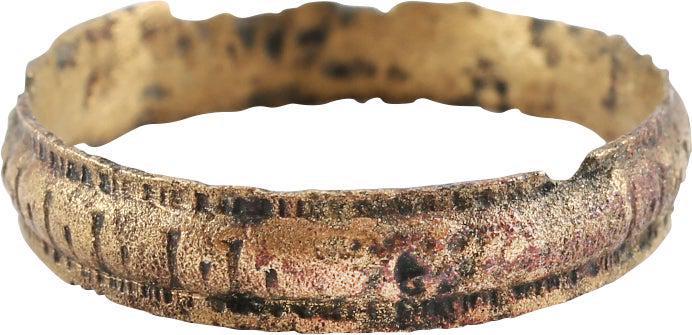 VIKING WEDDING RING, 866-1067 AD. SIZE 7: Danelaw England. Gilt bronze, size 7. 3.4mm width, with raised edges and high rounded, cross banded, or roped center. As found condition with considerable gold surface remaining. Gift boxed with certi