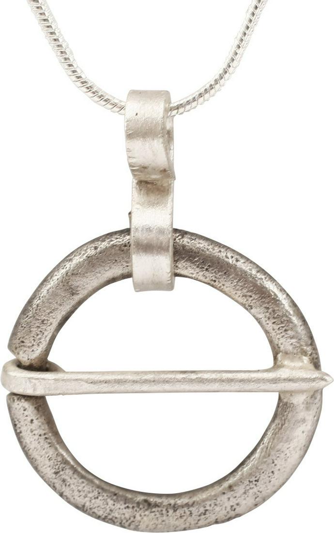 VIKING PROTECTIVE ARMOR BROOCH NECKLACE, 10th-11th: Silvered bronze. Just over 78" diameter. Oval section with ridged outed edge and tapered cross pin. When fastened to the jerkin, these small metal brooches provided a measure of protection against swo