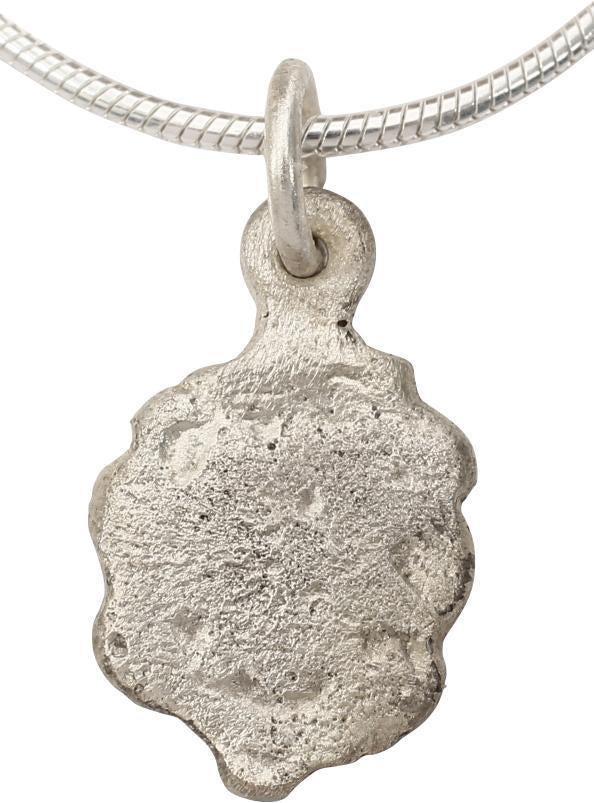 ENGLISH TUDOR LADIES NECKLACE C.1485-1603: The period of Henry VIII and Elizabeth I. Silvered bronze, 5/8” height. Scalloped edge surrounding the Tudor rose, now well worn and mostly indistinguishable. Probably worn by a woman in the ser