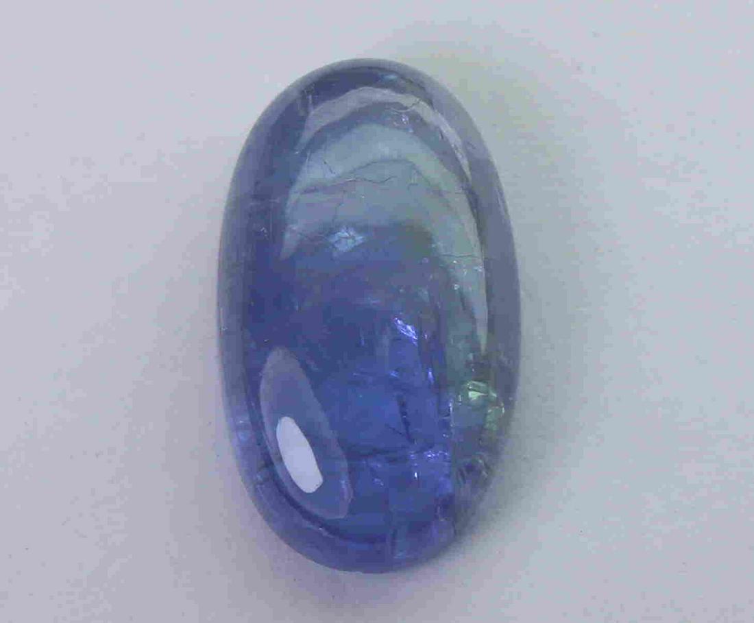 6.03 Cts Natural Tanzanite: No Reserve! Title: 6.03 Cts Natural Tanzanite Additional Information: Gemstone : Natural Tanzanite Origin : Tanzania Weight : 6.03 carats Dimensions : 14.9x8.64x4.6 mm Shape : Ovel Cabochon Color : Vi