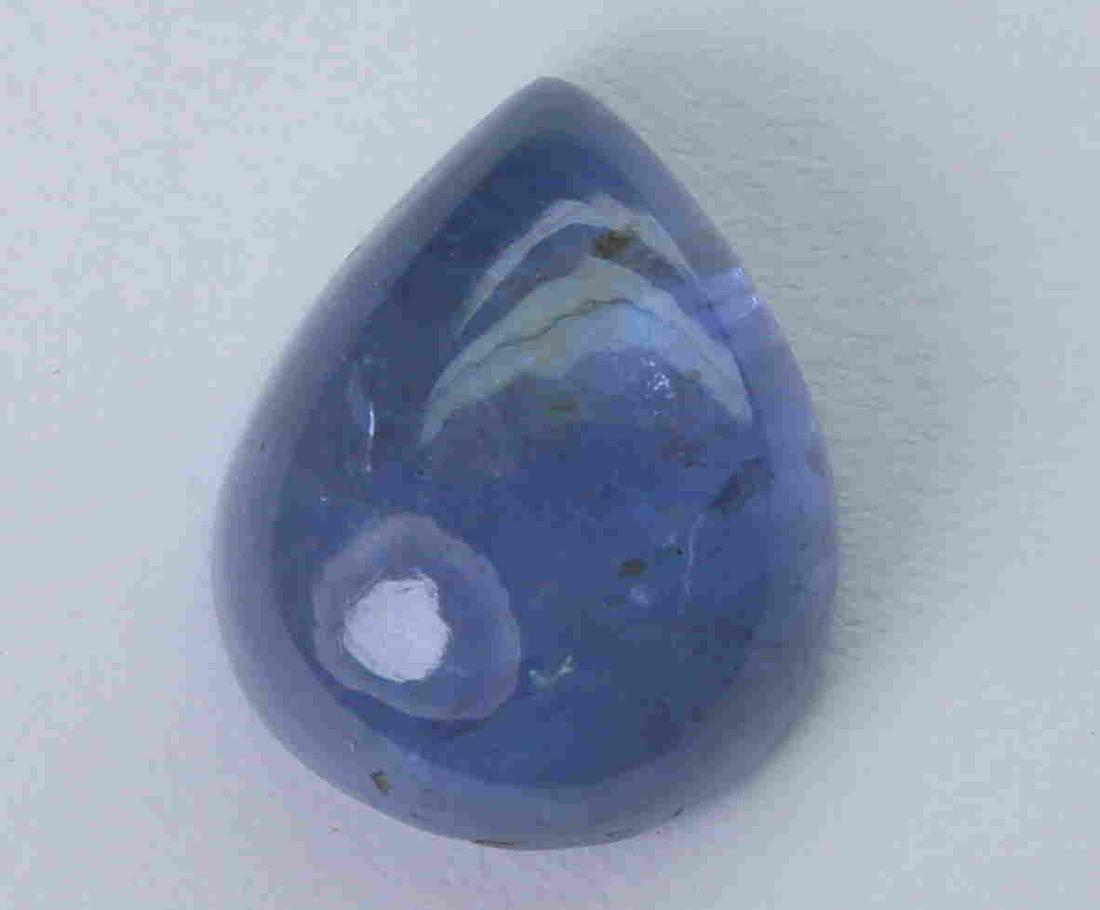 6.01 Cts Natural Tanzanite: No Reserve! Title: 6.01 Cts Natural Tanzanite Additional Information: Gemstone : Natural Tanzanite Origin : Tanzania Weight : 6.01 carats Dimensions : 12.19x9.75x5.73 mm Shape : Pear Cabochon Color : 