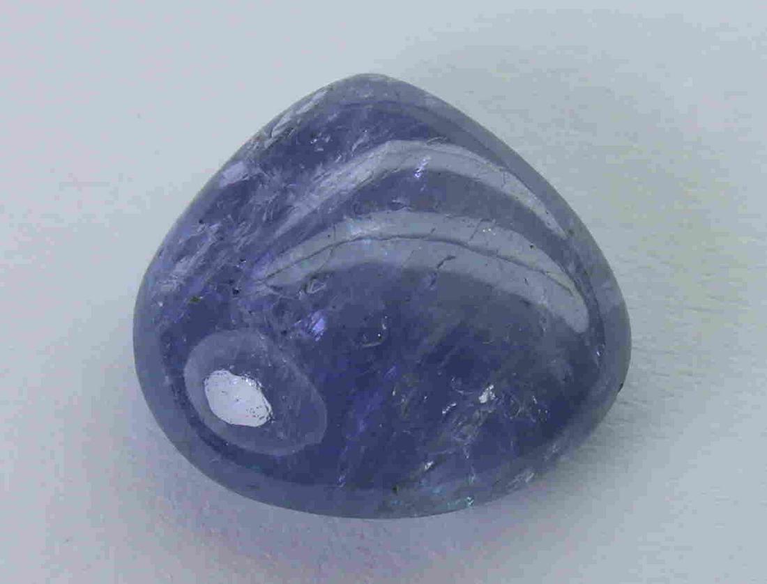 9.28 Cts Natural Tanzanite: No Reserve! Title: 9.28 Cts Natural Tanzanite Additional Information: Gemstone : Natural Tanzanite Origin : Tanzania Weight : 9.28 carats Dimensions : 13.05x13.87x6.11 mm Shape : Pear Cabochon Color :