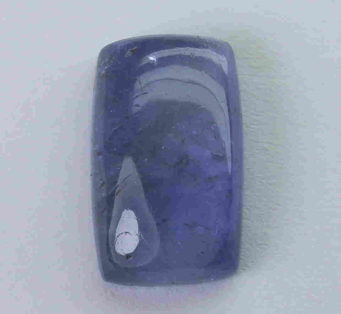 5.14 Cts Natural Tanzanite: No Reserve! Title: 5.14 Cts Natural Tanzanite Additional Information: Gemstone : Natural Tanzanite Origin : Tanzania Weight : 5.14 carats Dimensions : 13.18x8.01x4.05 mm Shape : Ractangular Cushen Cab